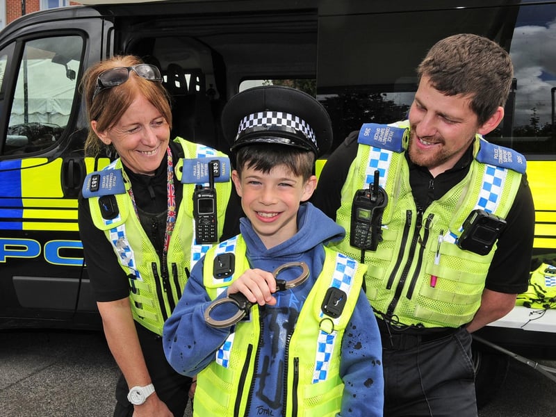 Eight-year-old Max Daly, of Moortown, with PCSO Sian Riley and PCSO Allan Holmes of Stainbeck Police Station