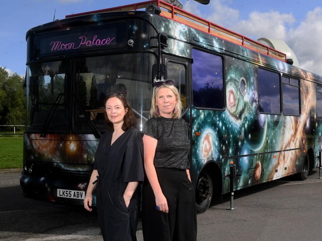 Kerry Harker (left) from the East Leeds Project and Abby Dix-Mason (right) from Foxglove are pictured with the Moon Palace touring bus at Fearnville Playing Fields, Leeds.