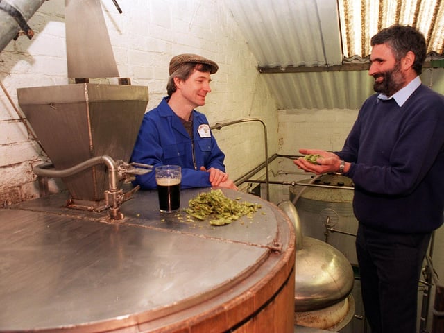 Sean Tomlinson, left, owner of Oldcastle Breweries, with Graham Tock checking on the hops in March 1997.