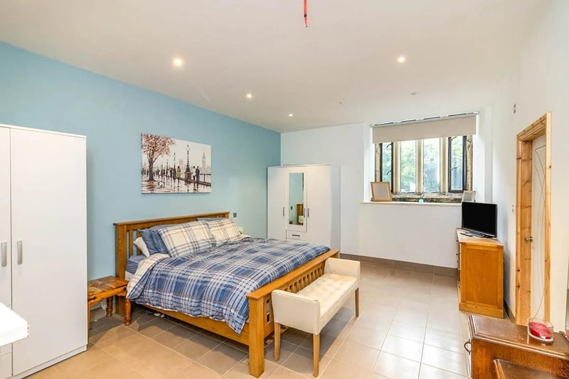 A charming double bedroom with a tiled floor and window which gives lots of light.
