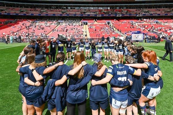 Rhinos players and staff huddle after their Wembley loss to Saturday's Super League semi-final foes St Helens. Picture by Matthew Merrick/SWpix.com.