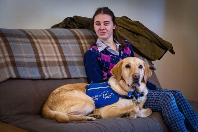 Molly Birch with disability assistance support dog Chess