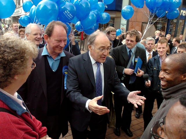 Michael Howard, the Conservative MP, pictured during a visit to Leeds in 2004. He was walking through Leeds city centre shaking hands with potential voters.