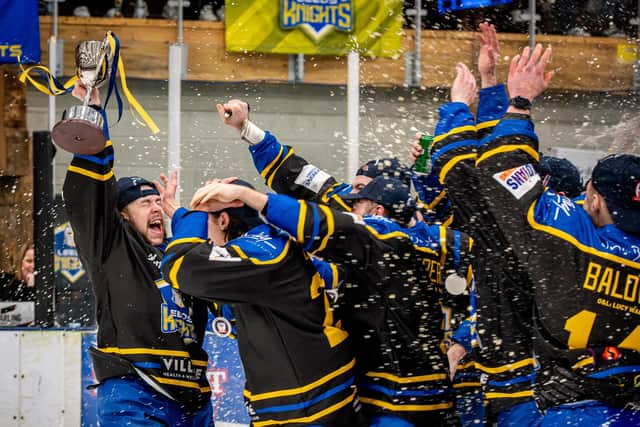 WINNERS: Leeds Knights' captain Kieran brown lifts the NIHL National Cup trophy aloft as his team-mates celebrate after their 8-6 aggregate win over Romford Raiders. Picture: Ben Gordon/Knights Media.