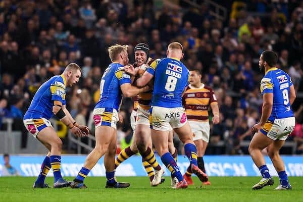 Rhinos' Mikolaj Oledzki gets to grips with Huddersfield prop Chris Hill during last season's draw at Headingley. Picture by Alex Whitehead/SWpix.com.