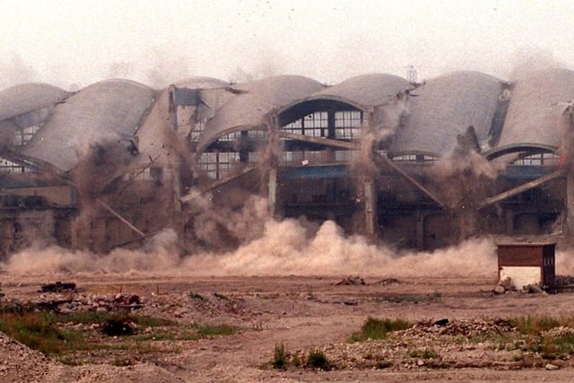 The turbine hall of the former Skelton Grange B power station start to fall to the ground during a controlled explosion.
