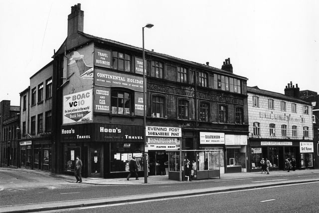 Yorkshire College of Music on The Headrow in October 1981. On the left is Park Cross Street. Hood's Travel shop has a poster advertising 1982 brochures. The block of property has the lettering 'Yorkshire Training College of Music' along the front. It has since been demolished.