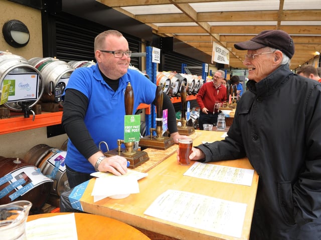 Dave Hawkin, a member of the Rotary Club of Roundhay, chats to Stuart Claughton over a beer.