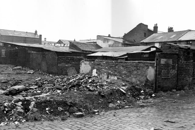 All Saints Street in October 1966. The photo shows waste land, on the right the rear of the buildings fronting onto Pottery Yard, visible is a sign for R.E. Carter, while in the centre, in the distance hoardings are visible advertising soup.