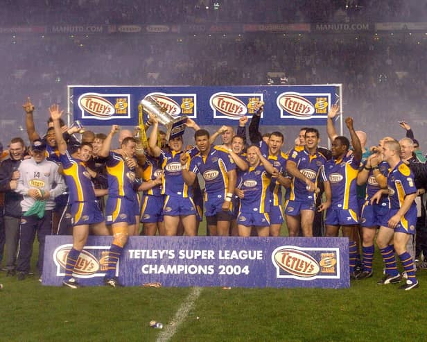 Leeds Rhinos celebrate with the Super League trophy after beating Bradford Bulls in the Grand Final at Old Trafford on October 16, 2004.