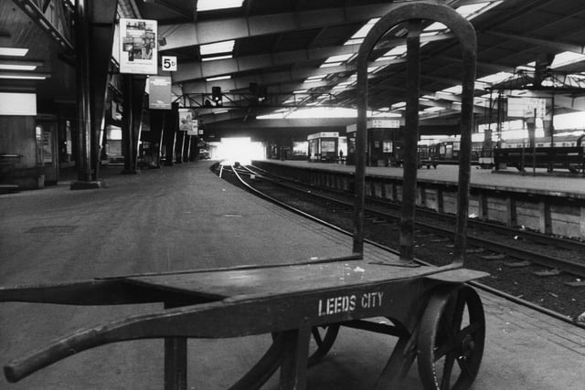 A porter's barrow stands empty on one of the deserted platforms at Leeds City Station in March 1976, from where only a limited service of local trains are operating owing to a rail strike.