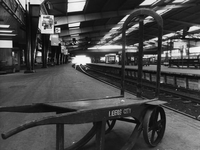 A porter's barrow stands empty on one of the deserted platforms at Leeds City Station in March 1976, from where only a limited service of local trains are operating owing to a rail strike.
