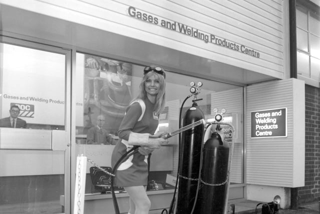 Miss BOC Swedish model Ischi Bernell, opens a new welding product centre at the British Oxygen works in Leeds by cutting a chain with a flame cutter in January 1970.