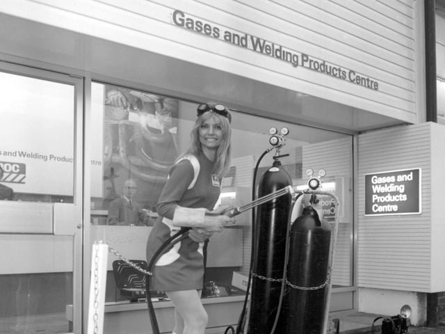 Miss BOC Swedish model Ischi Bernell, opens a new welding product centre at the British Oxygen works in Leeds by cutting a chain with a flame cutter in January 1970.