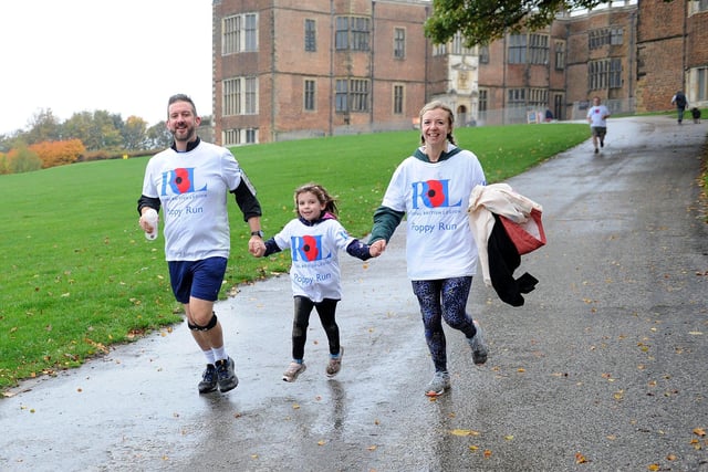 Simon and Chloe Middleyard give a helping hand to daughter Maisie, aged seven.