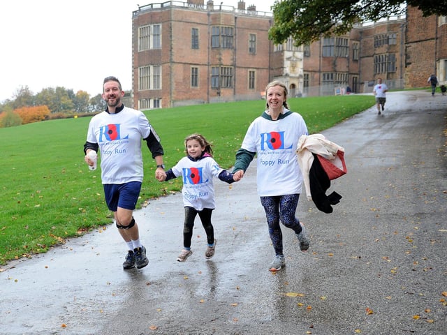 Simon and Chloe Middleyard give a helping hand to daughter Maisie, aged seven.