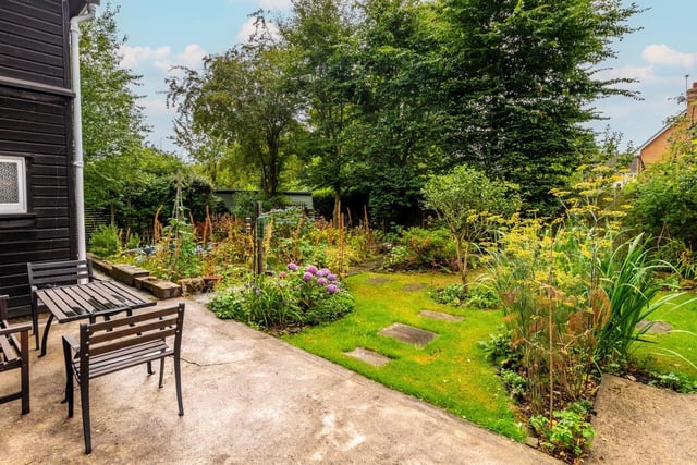 To the rear of this stunning home, the south-facing grounds are a gardener’s paradise: a vegetable patch, fruit trees and berry bushes provide the perfect kitchen garden.
