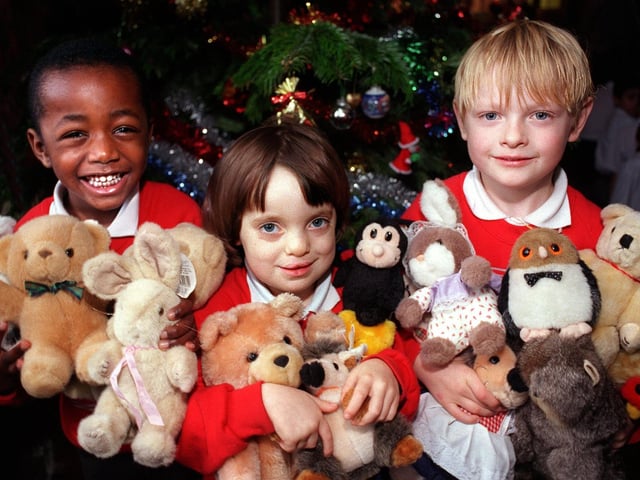 Children from Cookridge Primary School with some of the cuddly toys that were collected in December 1999. Pictured, from left, are Elliott Rock, Georgina Maher and Daniel Smithson.