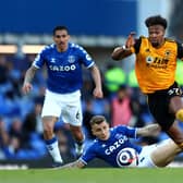 Adama Traore of Wolverhampton Wanderers battles for possession with Lucas Digne of Everton  during the Premier League match between Everton and Wolverhampton Wanderers at Goodison Park on May 19, 2021 in Liverpool, England. (Photo by Jan Kruger/Getty Images)