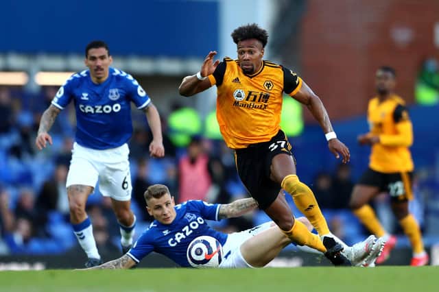 Adama Traore of Wolverhampton Wanderers battles for possession with Lucas Digne of Everton  during the Premier League match between Everton and Wolverhampton Wanderers at Goodison Park on May 19, 2021 in Liverpool, England. (Photo by Jan Kruger/Getty Images)