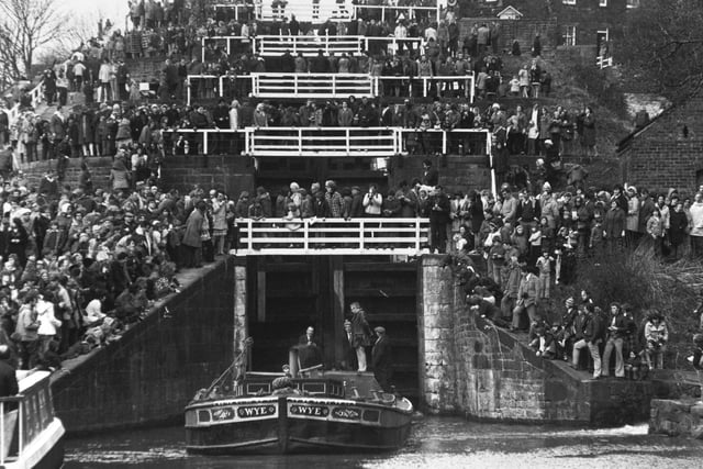 Like football fans on the terraces, thousands watch the barge Wye as she marks the 200th anniversary of a Yorkshire engineering feat in March 1974. It was the construction of the Five-Rise locks on the Leeds and Liverpool Canal at Bingley.