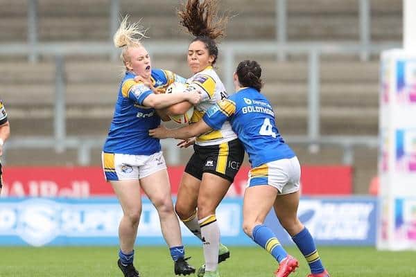 Rhinos' Fran Goldthorp, right and Keara Bennett tackle Savannah Andrade of York City Knights. Picture by John Clifton/SWpix.com.