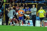 Ryan Hall gathers a kick from Danny McGuire and evades Scott Grix, now Leeds Rhinos' assistant-coach, to score the last-gasp try against Huddersfield Giants which secured the league leaders' shield in 2015. Picture by Steve Riding.