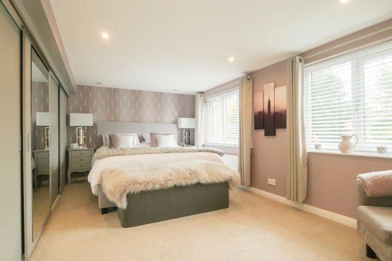 Bedroom two is a wonderful sized double room and has a range of fitted wardrobes with sliding doors.