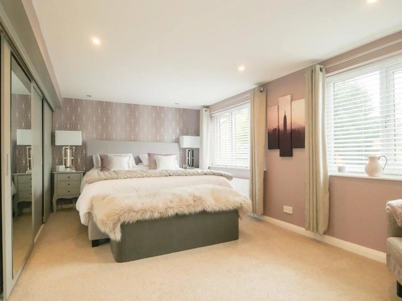 Bedroom two is a wonderful sized double room and has a range of fitted wardrobes with sliding doors.