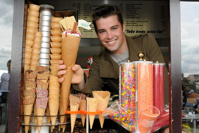 Joe McElderry tries his hand at serving an ice cream in 2011.