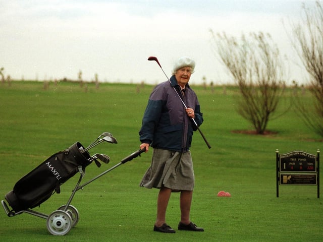 Golfer Olive West, 92, walks to the first tee at Bridlington Golf Club in November 1998.