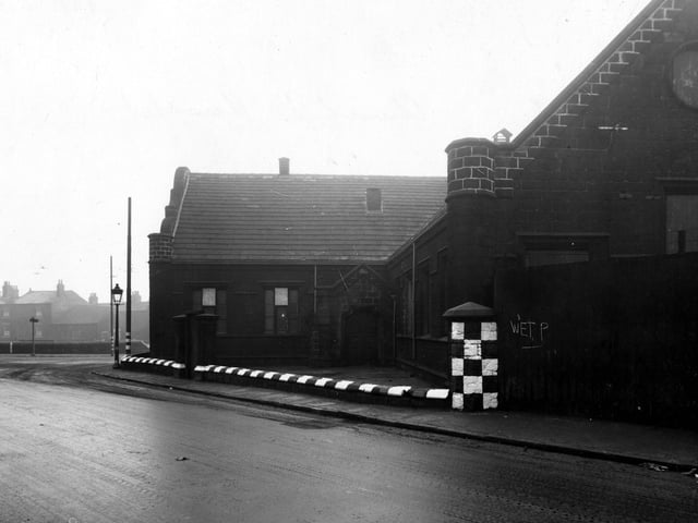 The premises of John Nicholson & Sons Ltd., (acid manufacturers), on Church Street, near the junction with Balm Road (on the left). The building, which was previously a school, has black and white checks and stripes for visibility during air-raid blackouts. Pictured in January 1943.