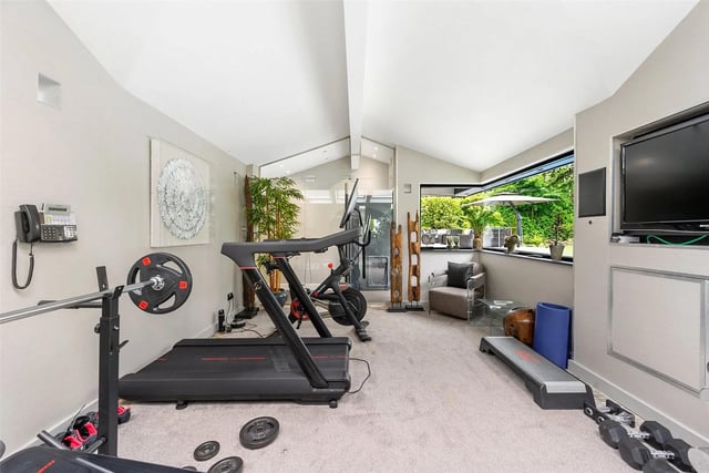 The home features a luxury gym and steam room with state-of-the-art technology running throughout the property.