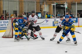 TOUGH NIGHT: Leeds Knights captain Kieran Brown (left) prepares to swivel round and get a shot on the Basingstoke net. Picture courtesy of Anna Alarie