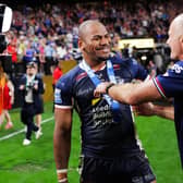 Man of the match Maika Sivo and coach Brad Arthur celebrate Leeds Rhinos' 58-6 victory over Hull KR in Las Vegas. Picture by Alex Whitehead/SWpix.com.