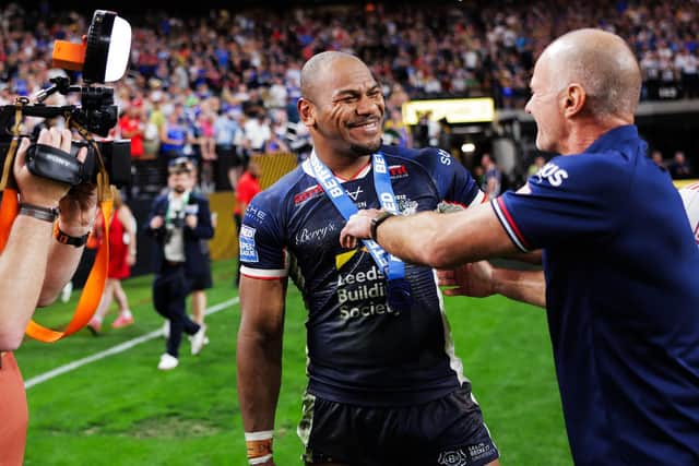 Man of the match Maika Sivo and coach Brad Arthur celebrate Leeds Rhinos' 58-6 victory over Hull KR in Las Vegas. Picture by Alex Whitehead/SWpix.com.