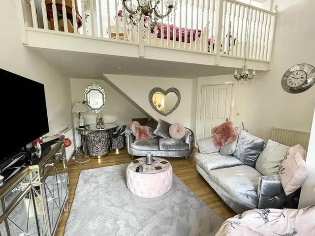 The interior includes a mezzanine level to the sitting room.