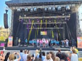 The Brownlees, centre, with kids' choir Class Dynamix onstage in Millennium Square.