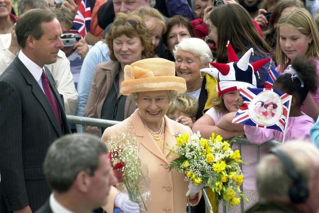 The Queen meets the crowd of well-wishers at Millennium Square.