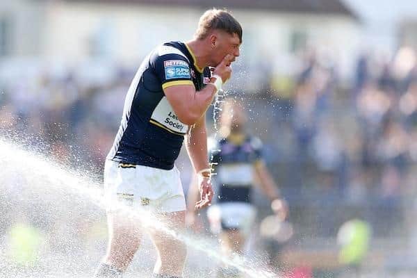 Tom Holroyd, whose cousin Adam Holroyd is in Warringtion Wolves' squad, cools down after Leeds Rhinos' win last August. He probably won't need the sprinklers on Friday. Picture by John Clifton/SWpix.com.
