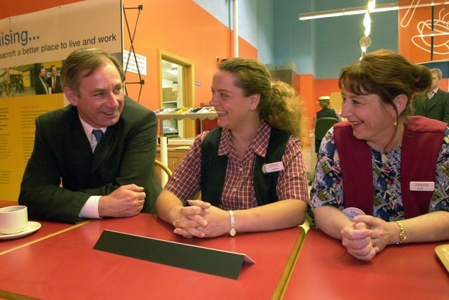 The Secretary of State for Defence, Geoff Hoon, talks to two members of staff at Tesco in Seacroft, Joanne Dockerty ,left, and Ann Leadbeater, on May 10, 2001.