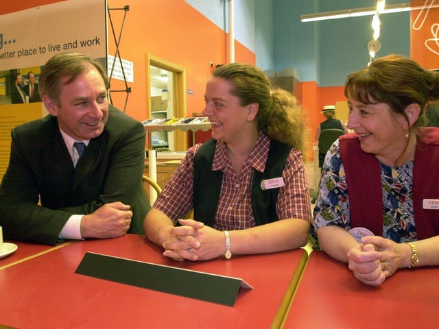 The Secretary of State for Defence, Geoff Hoon, talks to two members of staff at Tesco in Seacroft, Joanne Dockerty ,left, and Ann Leadbeater, on May 10, 2001.