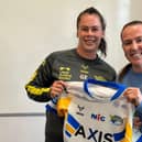Georgia Elliston, left, receives her Leeds Rhinos debut jersey from New Zealand star Georgia Hale. Picture by Leeds Rhinos.