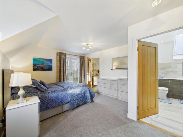 To the first floor are four well-proportioned double bedrooms, with the principal bedroom enjoying its own dressing room and en suite shower room.