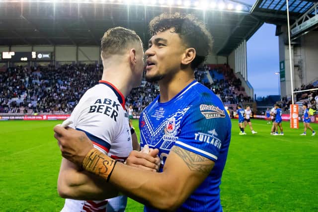No hard feelings between Harry Newman - of Leeds Rhinos and England - and Samoa's Junior Pauga after the match. Picture by Allan McKenzie/SWpix.com.