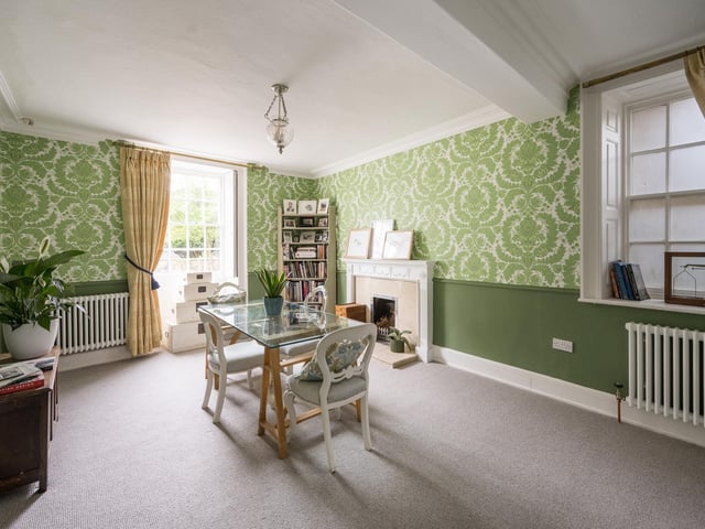 There are four ground floor reception rooms, this dining room being one of them.