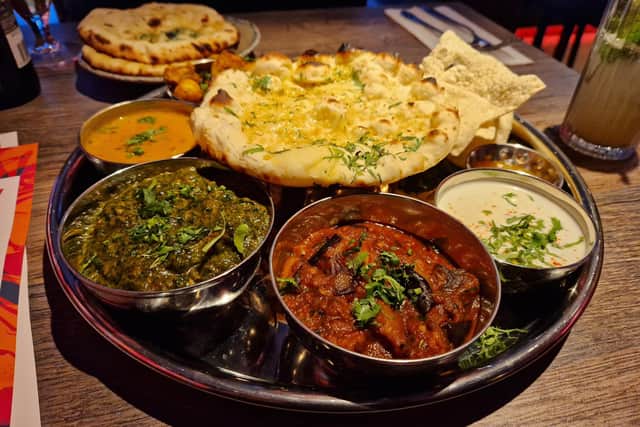 The Tamatanga thali includes poppadoms, chutney, two vegetable dishes that are rotated by the chefs, the daal of the day, raita, rice, one naan and two curries of your choice. Photo: National World