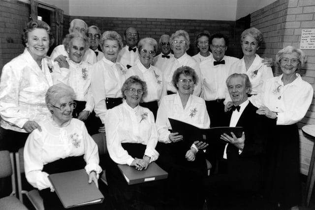 This  cheery gang of 'golden oldies' pictured in November 1992 which belts out the ballads of the past was proving a hit with people in south Leeds. The Belle Isle Day Centre Choir, formed 11 years ago, has a full diary touring community centres and pensioner homes which cannot get enough of them.  Under the baton of Walter Silver, the 20 men and women, average age around 65, have an accomplished programme from Black and White Minstrel classics to rousing choruses of Jerusalem and Holy City.
Pat Rowe, warden of the day centre at Belle Isle and a former choir leader, said: "Our choir gives and receives great satisfaction.  It is in constant demand".