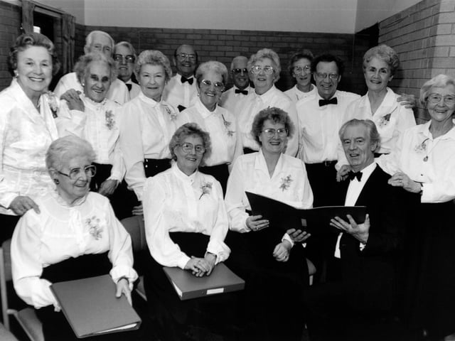 This  cheery gang of 'golden oldies' pictured in November 1992 which belts out the ballads of the past was proving a hit with people in south Leeds. The Belle Isle Day Centre Choir, formed 11 years ago, has a full diary touring community centres and pensioner homes which cannot get enough of them.  Under the baton of Walter Silver, the 20 men and women, average age around 65, have an accomplished programme from Black and White Minstrel classics to rousing choruses of Jerusalem and Holy City.
Pat Rowe, warden of the day centre at Belle Isle and a former choir leader, said: "Our choir gives and receives great satisfaction.  It is in constant demand".