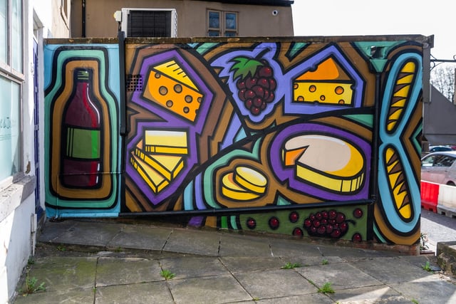 Chapel Allerton shoppers will no doubt immediately recognise this vibrant and playful mural. The ode to cheese, on the side of George & Joseph cheesemongers, is almost as popular as the shop itself - with many who pass it stopping to get a quick photo or a selfie with the artwork.